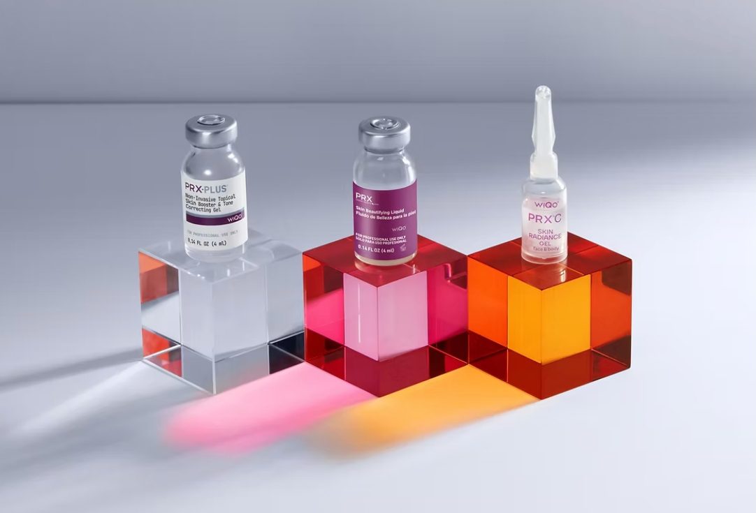 Three medical vials displayed on colorful acrylic blocks.