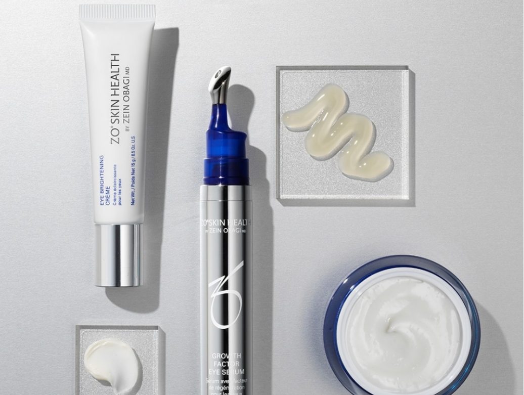 Skincare products arranged neatly with texture samples.