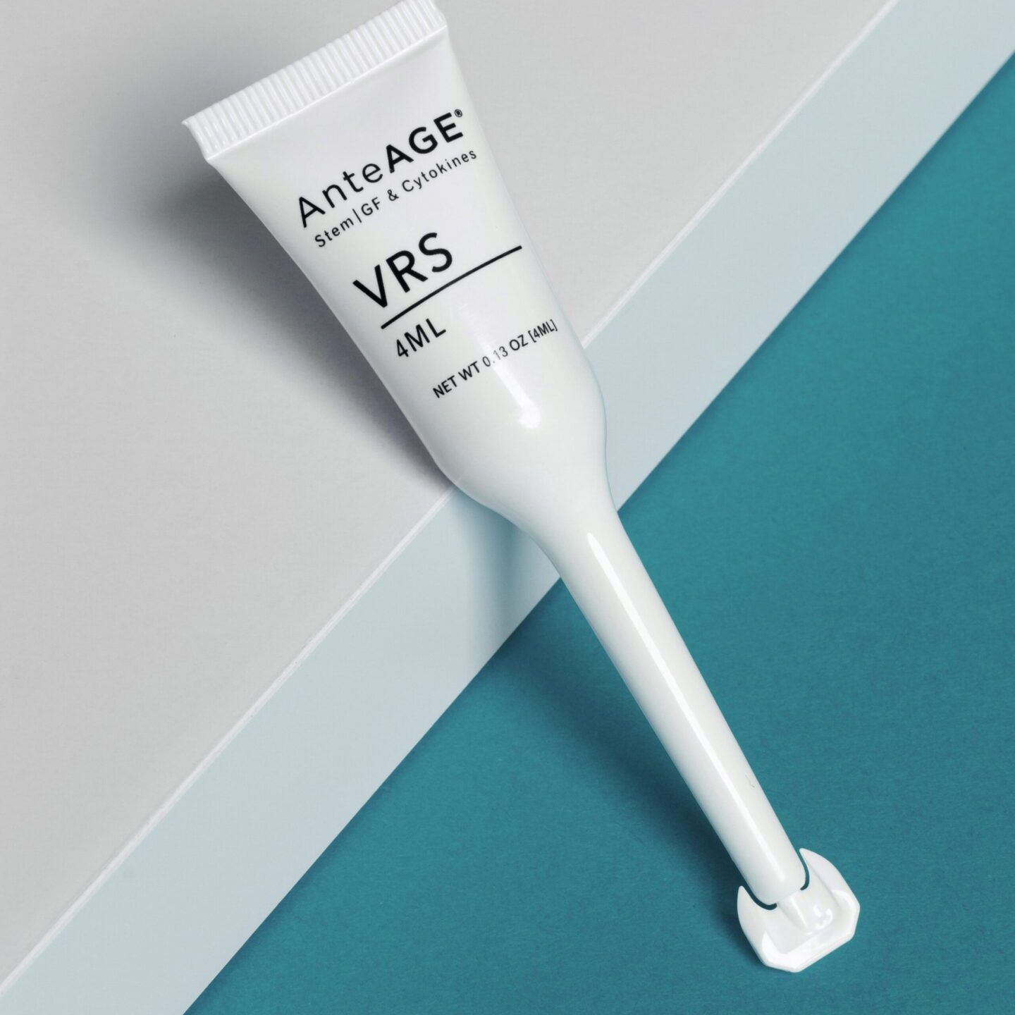 VRS Anti-Aging cream tube on a blue and white surface.